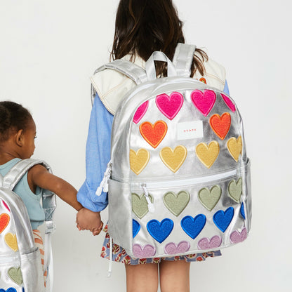 State Bags Signature - Kane Kids Double Pocket Backpack Metallic Fuzzy Hearts